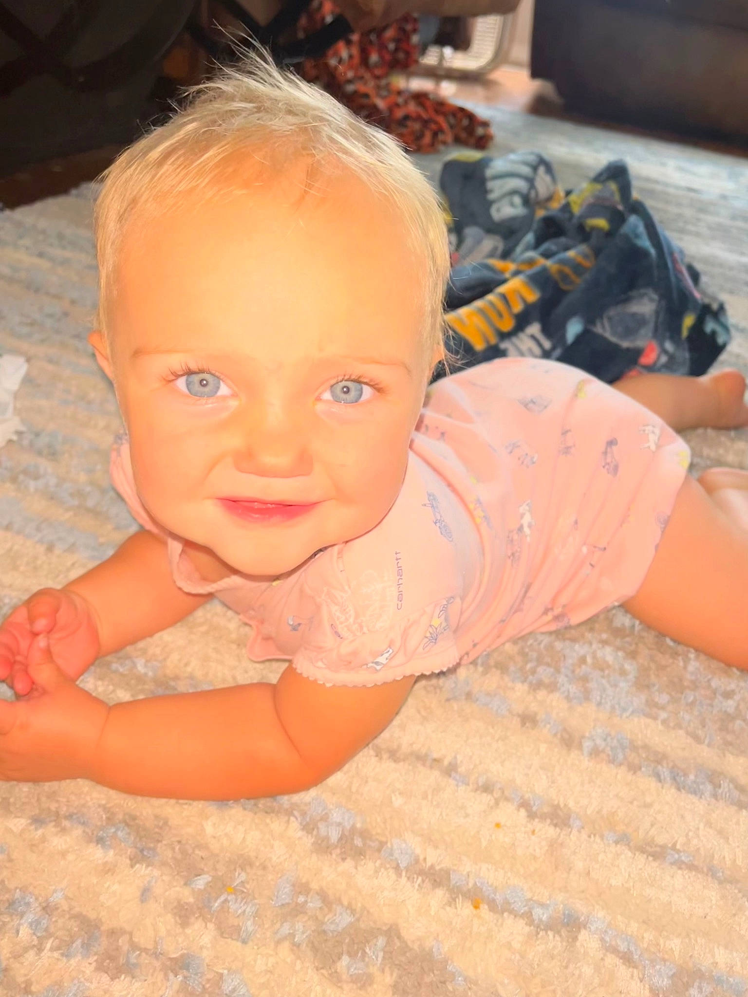 Lauryn is registered to the contest to win money with this photo: cheek, chest, child, chin, eye, face, floor, flooring, fun, happy, iris, joint, joy, leisure, mouth, nose, orange, person, sand, skin