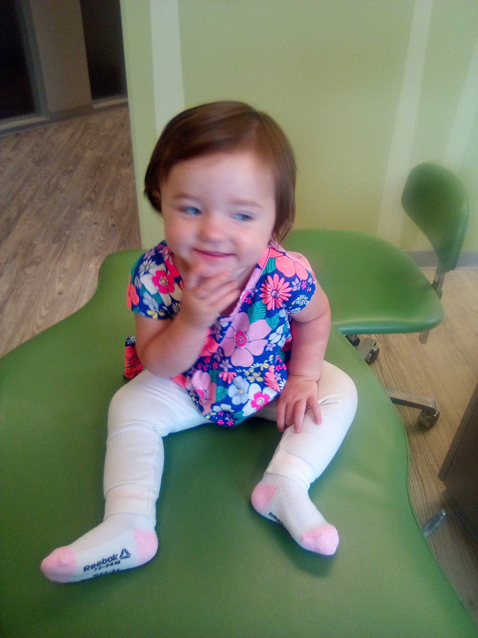 Laila is registered to the contest to win money with this photo: baby, baby_toddler_clothing, child, comfort, electric_blue, finger, floor, flooring, fun, happy, joy, knee, leisure, person, sitting, skin, sleeve, smile, sock, thigh