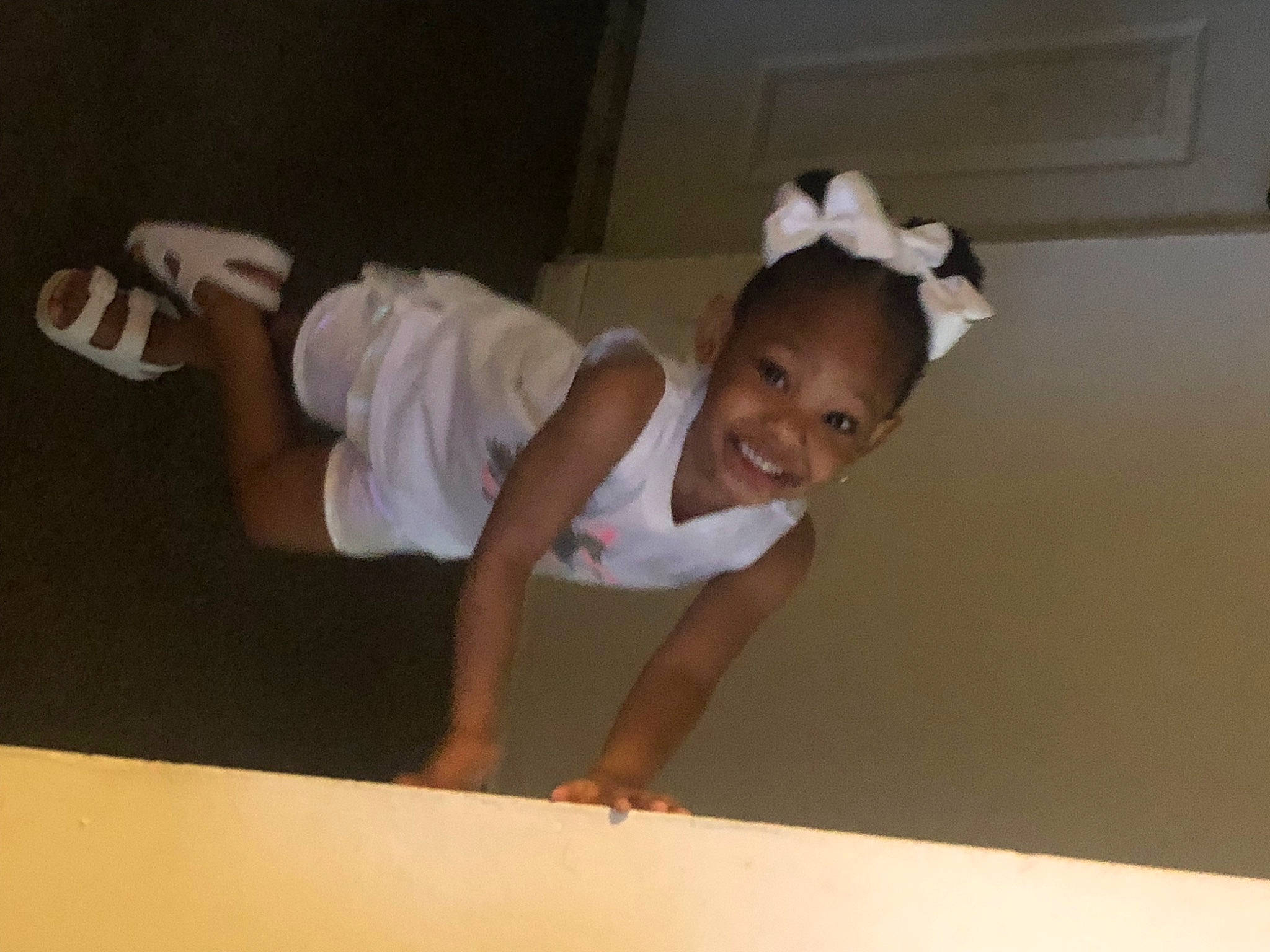 Rylynn joined the competition — help win amazing prizes! balance, ceiling, child, elbow, flash_photography, flooring, fun, gesture, happy, hardwood, human_leg, joy, knee, person, sleeve, smile, t_shirt, thigh, thumb, toddler