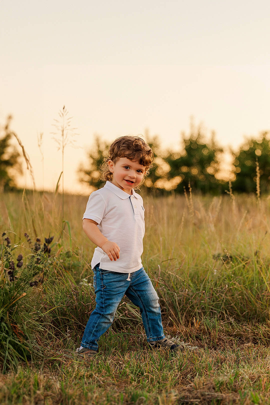 Waylen joined the competition — help win amazing prizes! child, field, flash_photography, gesture, grass, grassland, happy, horizon, jeans, joy, landscape, leisure, meadow, natural_landscape, people_in_nature, person, plant, prairie, sky, sunlight