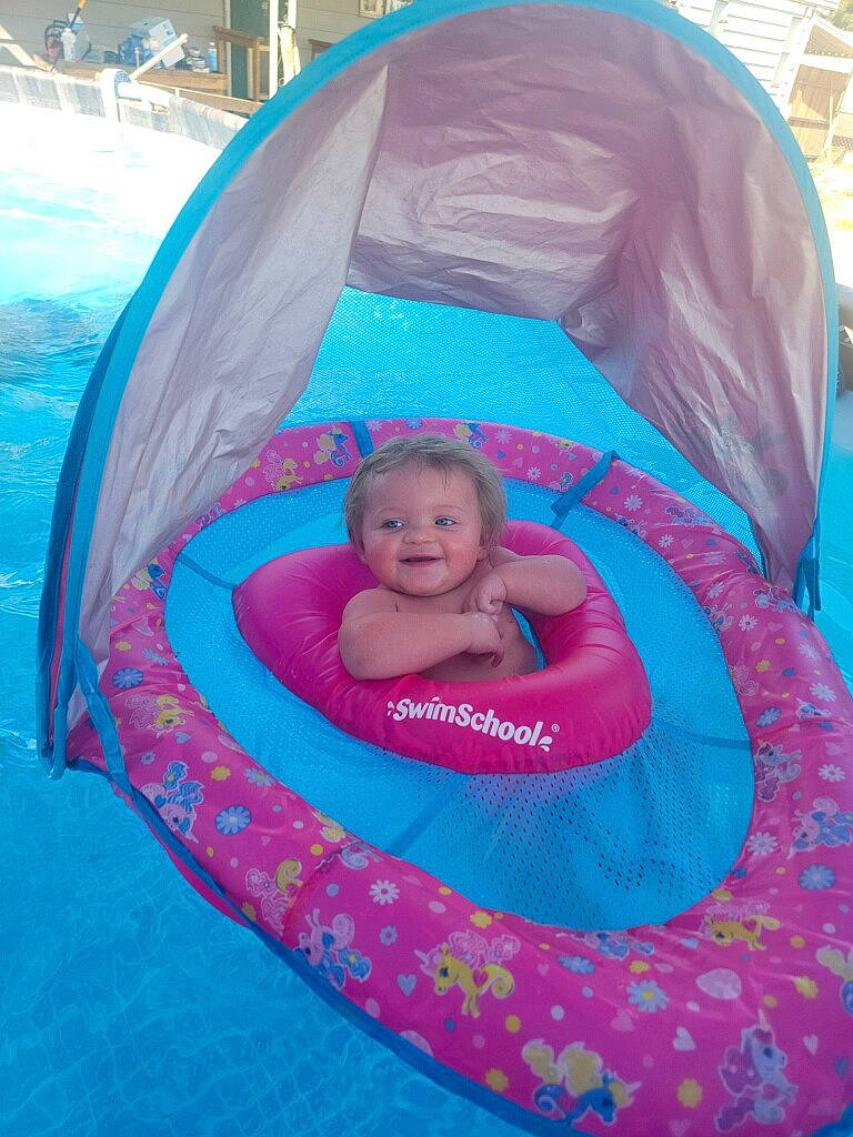 Zara is registered to the contest to win money with this photo: aqua, baby, baby_products, blue, child, circle, comfort, electric_blue, event, fashion_accessory, fun, inflatable, joy, leisure, magenta, person, pink, play, product, recreation