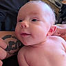 baby, infant, smiling, face, skin, tattoo, arm, person, indoors, closeup, expression, child, human, portrait, cute, happy, newborn, resting, head, eyes
