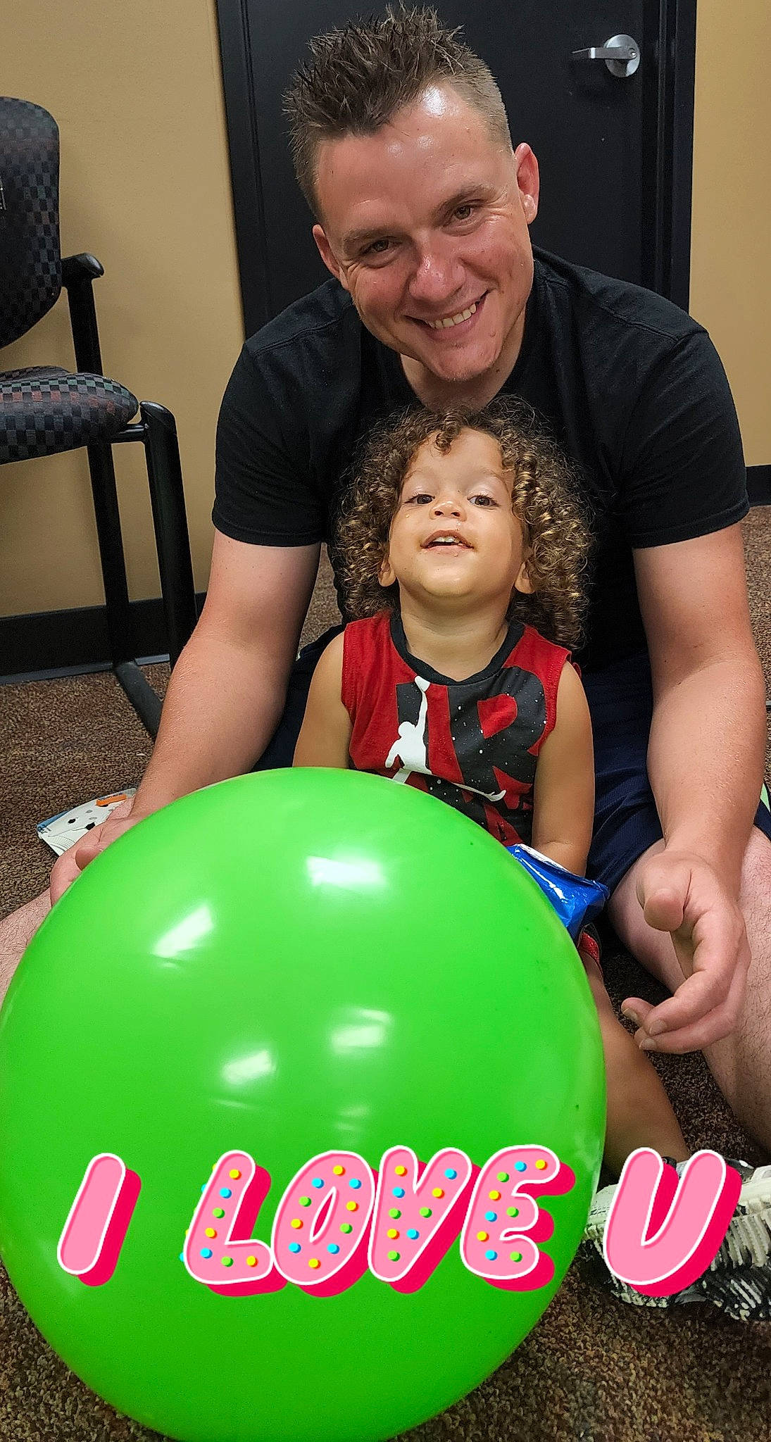 Jack is registered to the contest to win money with this photo: balloon, chair, child, event, face, fun, happy, holiday, joy, leisure, party, party_supply, person, play, recreation, shorts, smile, t_shirt, toddler, toy