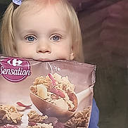 Marie-Michele participe au concours pour gagner de l'argent avec cette photo : baby, blonde, bowl, cream, dairy, dessert, eating, face, food, frozenyogurt, grain, granola, hair, head, icecream, person, photography, portrait, produce, snack