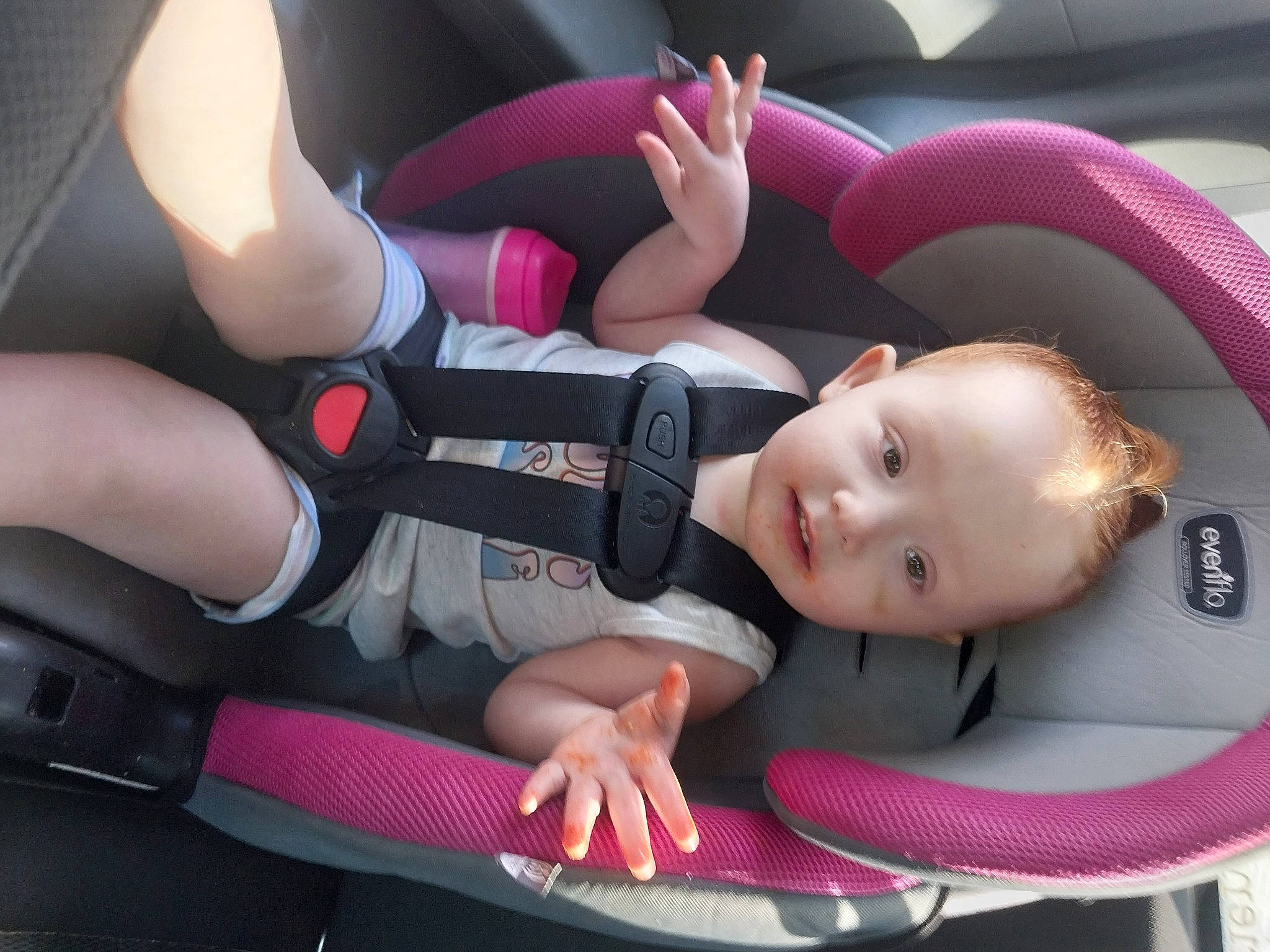 Shannon is registered to the contest to win money with this photo: auto_part, automotive_design, automotive_wheel_system, baby, baby_carriage, baby_in_car_seat, baby_products, baby_toddler_clothing, car, car_seat, car_seat_cover, child, comfort, person, seat_belt, steering_part, steering_wheel, toddler, vehicle, vehicle_door