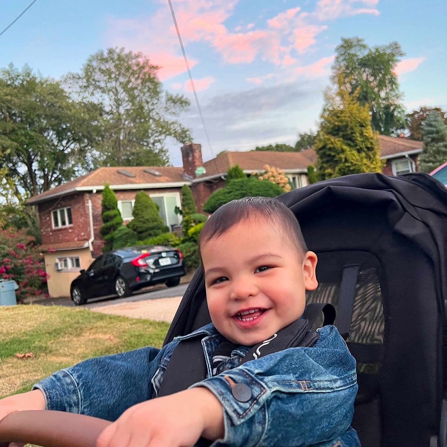 Mason joined the competition — help win amazing prizes! architecture, baby, building, car, clothing, coat, face, head, jeans, neighborhood, outdoors, pants, person, photography, plant, portrait, shelter, transportation, tree, vehicle