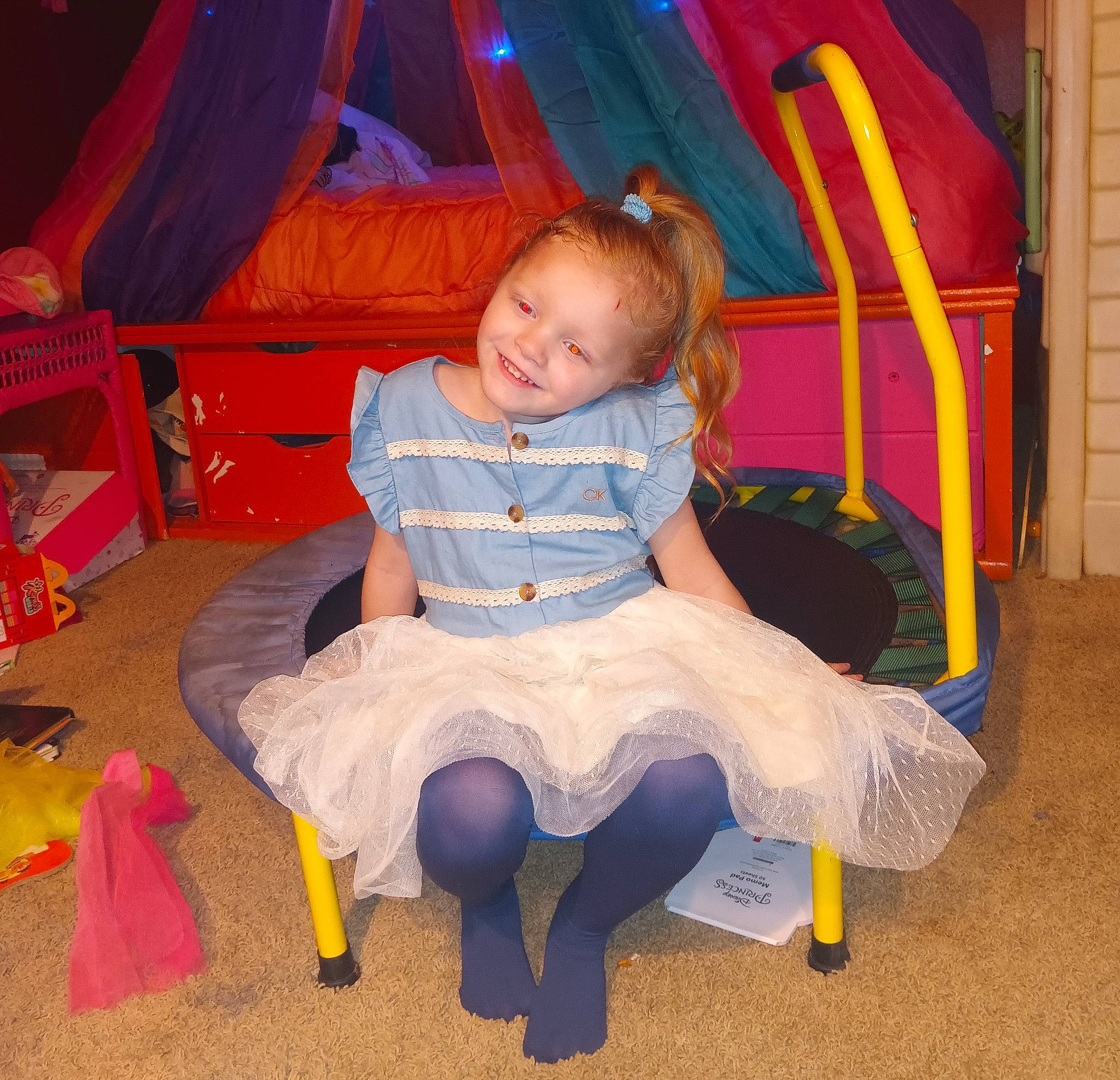 Starla is registered to the contest to win money with this photo: baby, baby_products, baby_toddler_clothing, baby_toys, chair, child, comfort, electric_blue, fun, joy, lap, leisure, magenta, person, play, product, room, sitting, smile, sock
