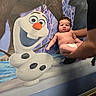 baby, infant, diaper, person, child, hands, wall_mural, olaf, frozen, snowman, cartoon, colorful, expression, indoor, holding, cute, chubby, background, art, character