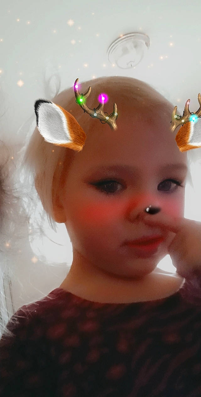 Willow is registered to the contest to win money with this photo: cheek, doll, dress, ear, eye, eyebrow, eyelash, fawn, head, headband, headgear, headpiece, human_body, iris, lip, nose, person, petal, pink, skin