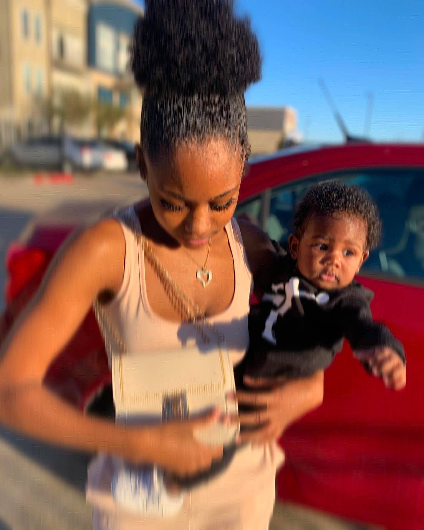 Saint Messiah is registered to the contest to win money with this photo: afro, bracelet, car, child, earrings, event, fashion, fun, gesture, hairstyle, happy, human, jewellery, joy, leisure, necklace, person, road, t_shirt, toddler