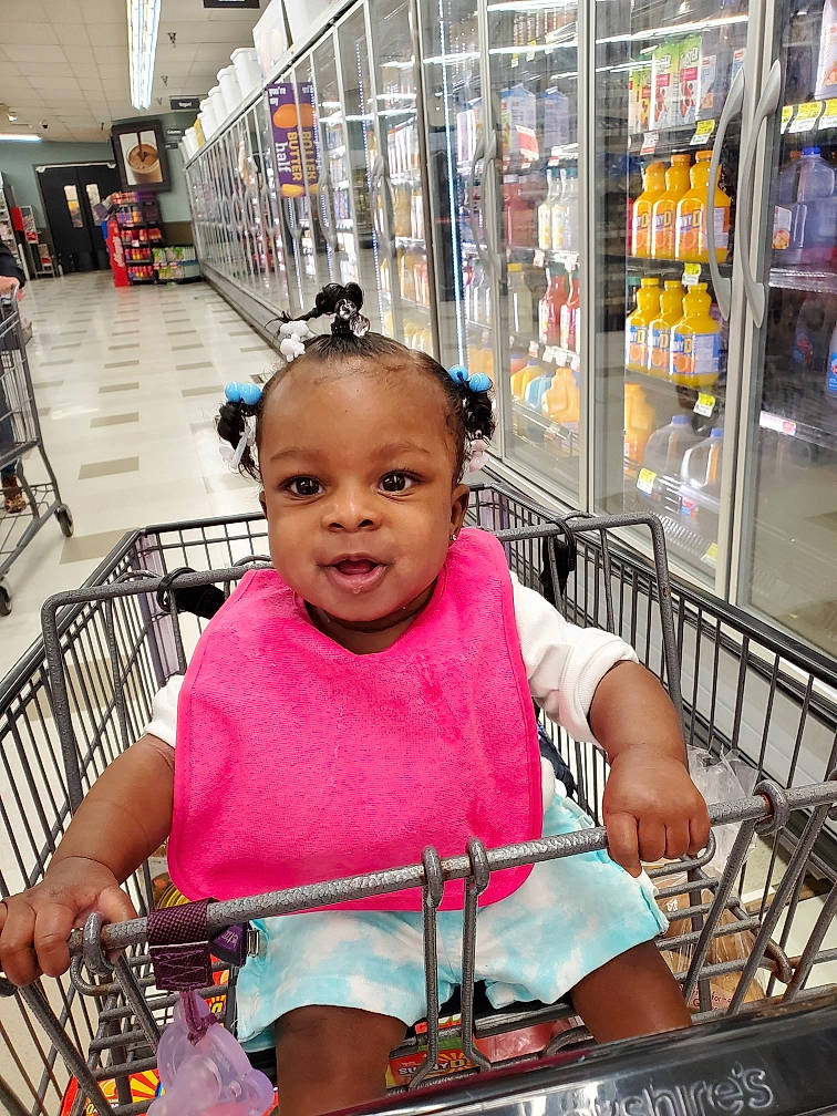 Lailonni is registered to the contest to win money with this photo: bag, cart, child, convenience_store, customer, fun, grocery_store, happy, market, person, photograph, product, retail, service, shopping, shopping_cart, skin, smile, snapshot, toddler