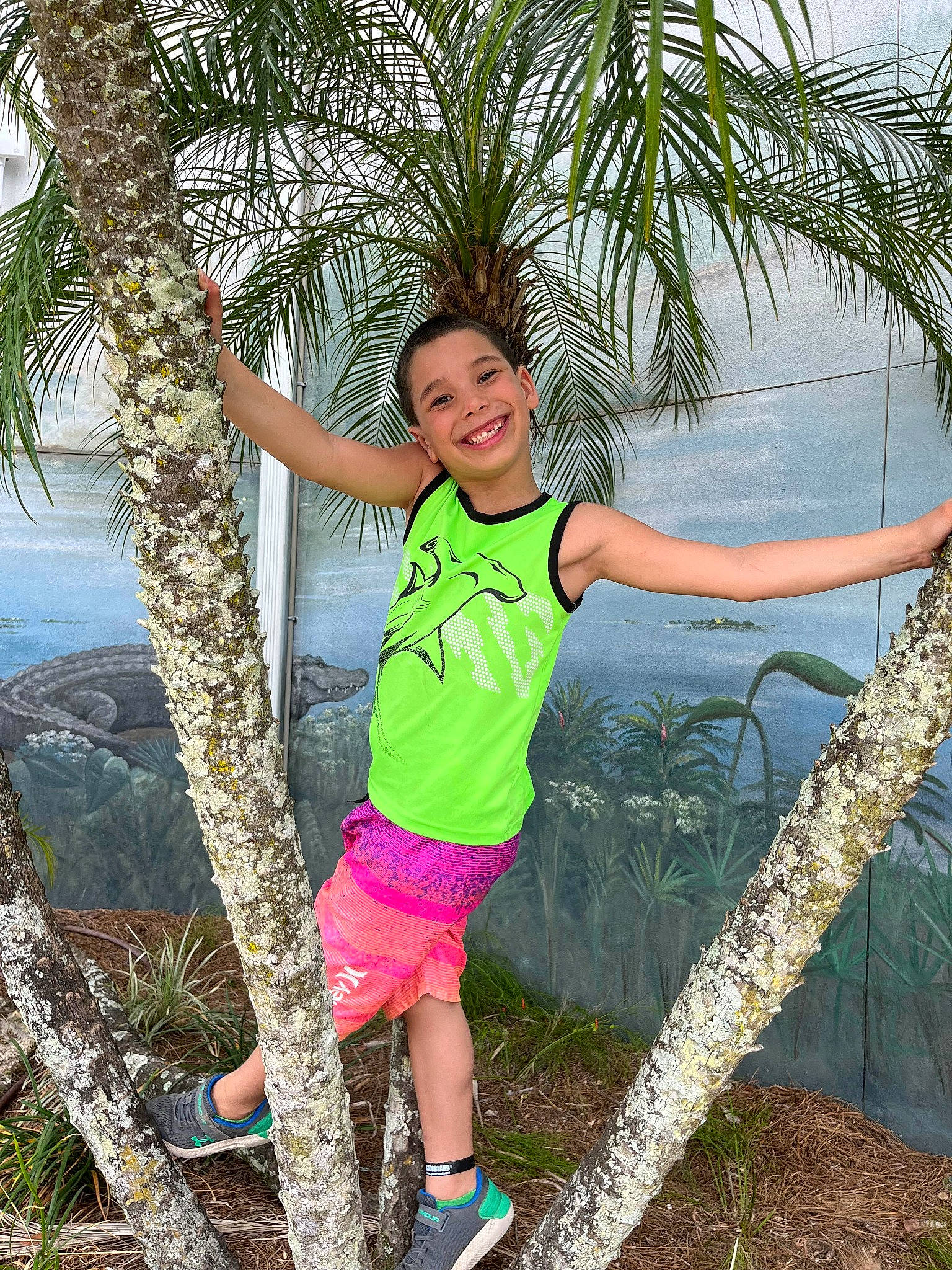 Joshua joined the competition — help win amazing prizes! arecales, botany, fun, grass, happy, joy, lake, leisure, nature, palm_tree, people_in_nature, person, plant, shorts, smile, terrestrial_plant, travel, tree, tropics, vegetation