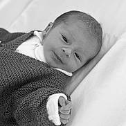 Malo participe au concours pour gagner de l'argent avec cette photo : baby, newborn, infant, black_and_white, knitted_sweater, blanket, hand, face, portrait, sleeping, soft_texture, cozy, cute, person, young_child, indoors, closeup, resting, small, peaceful