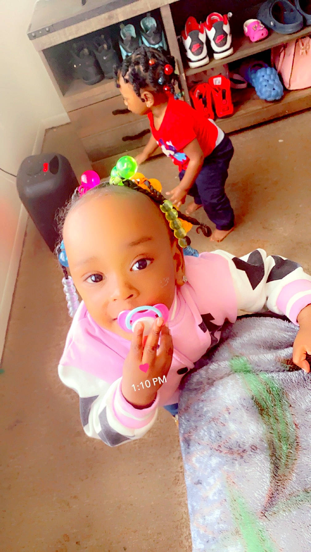 Alaizah is registered to the contest to win money with this photo: arm, baby, baby_toddler_clothing, child, event, foot, fun, gesture, happy, leisure, magenta, nail, person, pink, play, sitting, thigh, thumb, toddler