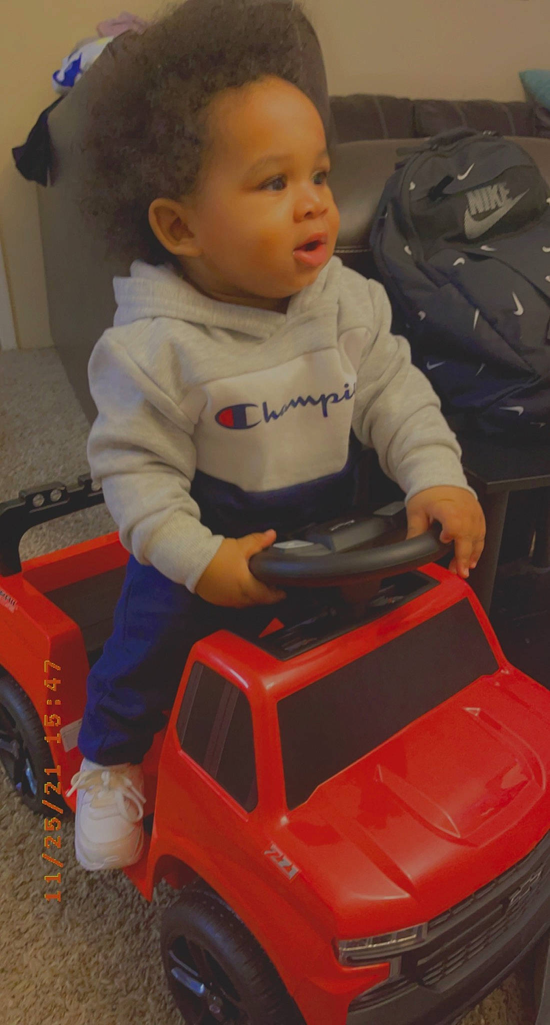 Carsen is registered to the contest to win money with this photo: automotive_design, automotive_exterior, automotive_lighting, automotive_tire, baby, baby_toddler_clothing, bumper, car, child, hood, motor_vehicle, person, riding_toy, sitting, snapshot, tire, toddler, vehicle, vehicle_door, wheel