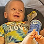 toddler, child, car_seat, tie_dye_shirt, smiling, feet, blue_container, baby, happy, infant, clothing, seatbelt, closeup, portrait, cute, foot, expression, indoor, holding, colorful