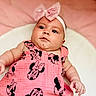 Lydia is registered to the contest to win money with this photo: baby, infant, child, pink_dress, minnie_mouse, headband, bow, cute, portrait, closeup, soft_background, chubby_cheeks, skin, arm, hand, clothing, indoors, person, young_child, expression