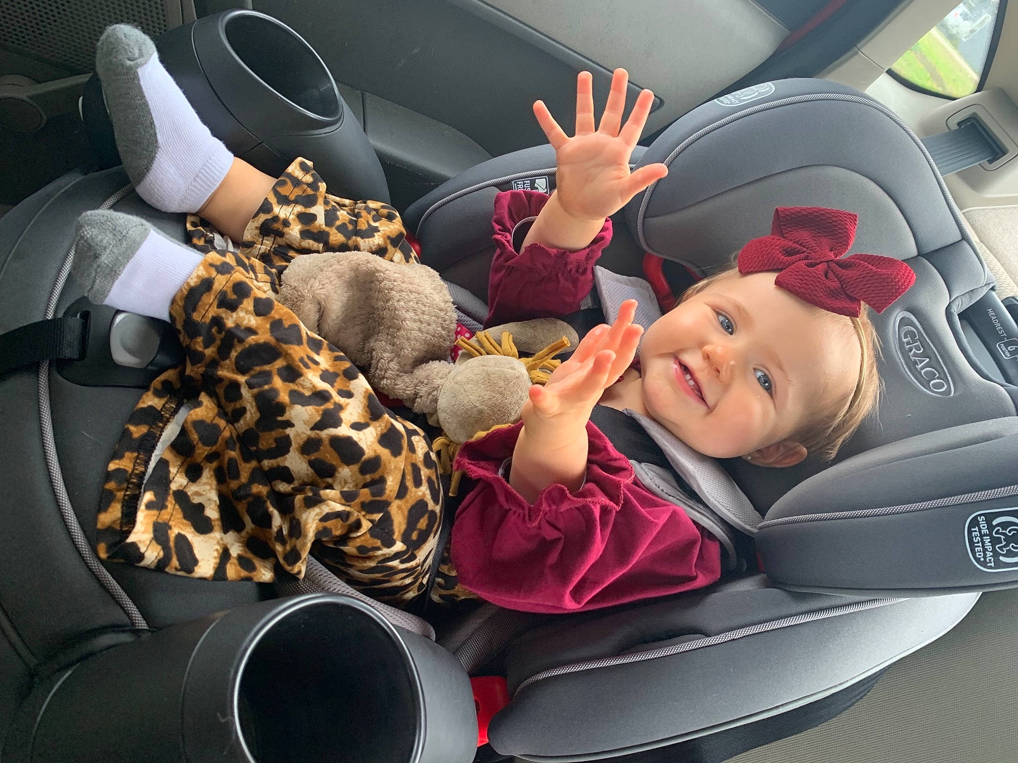 Sadie is registered to the contest to win money with this photo: auto_part, automotive_design, automotive_exterior, baby, baby_in_car_seat, car, car_seat, car_seat_cover, comfort, head_restraint, headwear, joy, motor_vehicle, person, personal_luxury_car, seat_belt, service, smile, steering_part, steering_wheel