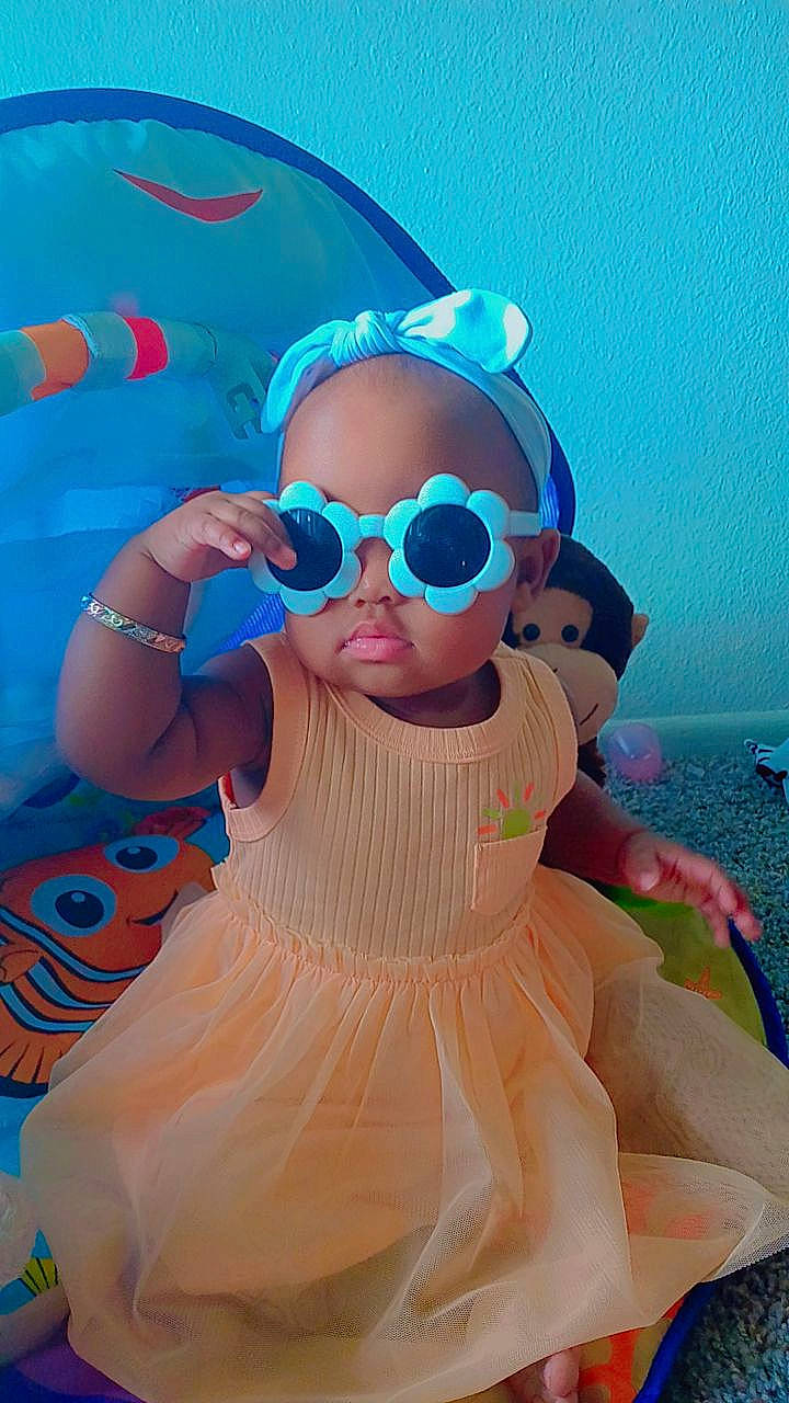 Aviana is registered to the contest to win money with this photo: azure, baby_toddler_clothing, child, cool, costume, electric_blue, eyewear, fun, goggles, happy, head, headgear, leisure, magenta, person, personal_protective_equipment, pink, sunglasses, thigh, toddler