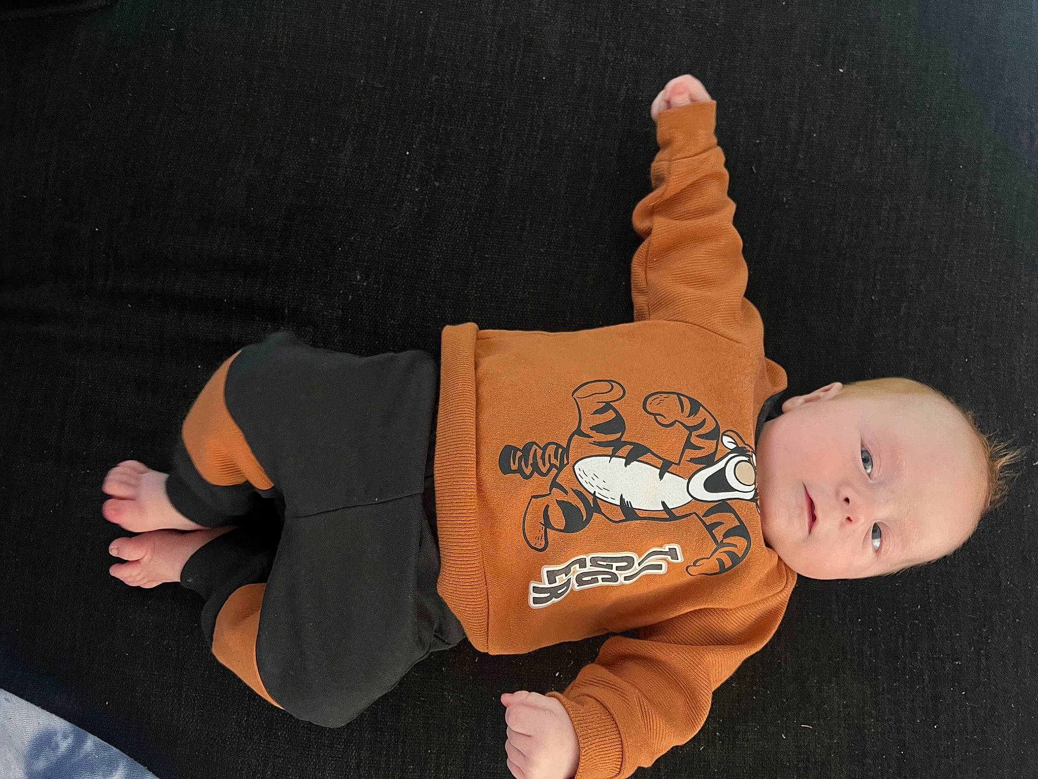 Cayden is registered to the contest to win money with this photo: arm, baby, baby_products, baby_toddler_clothing, baby_toys, child, finger, font, gesture, hand, happy, human_body, person, room, sitting, sleeve, stuffed_toy, thumb, toddler, toy