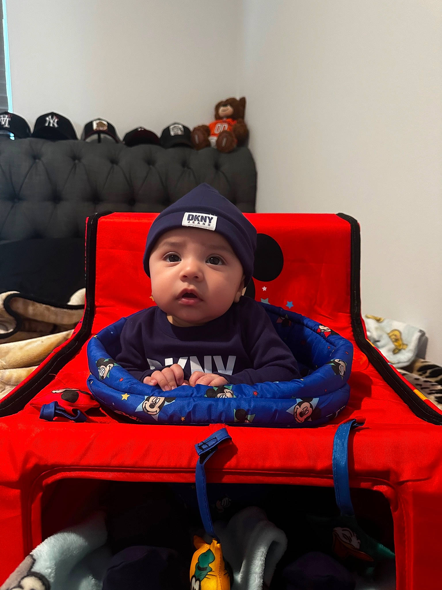 Santiago is registered to the contest to win money with this photo: auto_part, automotive_design, automotive_tire, baby, baby_carriage, baby_products, cap, carmine, comfort, electric_blue, fun, headwear, leisure, motor_vehicle, person, personal_protective_equipment, recreation, room, sitting, tire