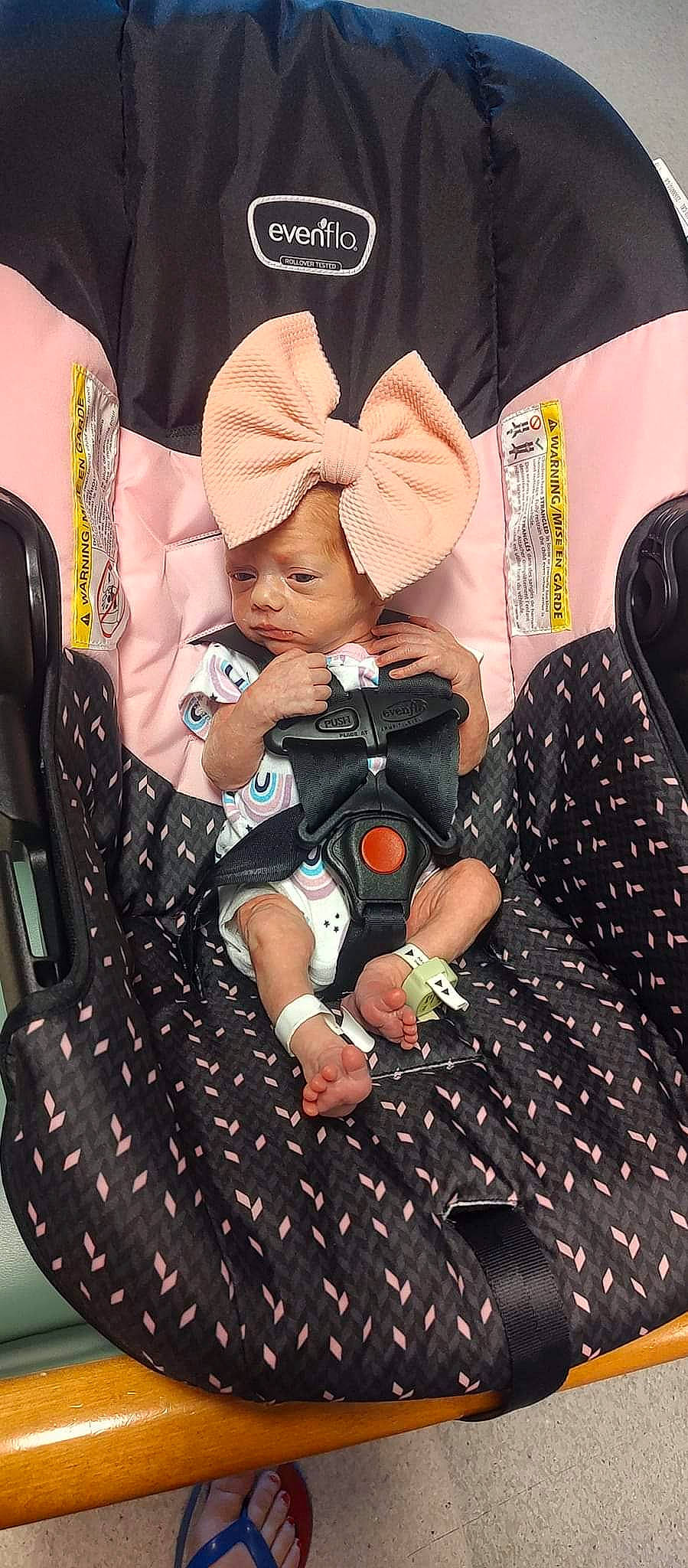 Madison is registered to the contest to win money with this photo: baby, baby_carriage, baby_products, baby_sleeping, baby_toddler_clothing, bag, cap, car_seat, child, comfort, cool, fashion_accessory, headwear, luggage_and_bags, pattern, person, product, sitting, t_shirt, textile