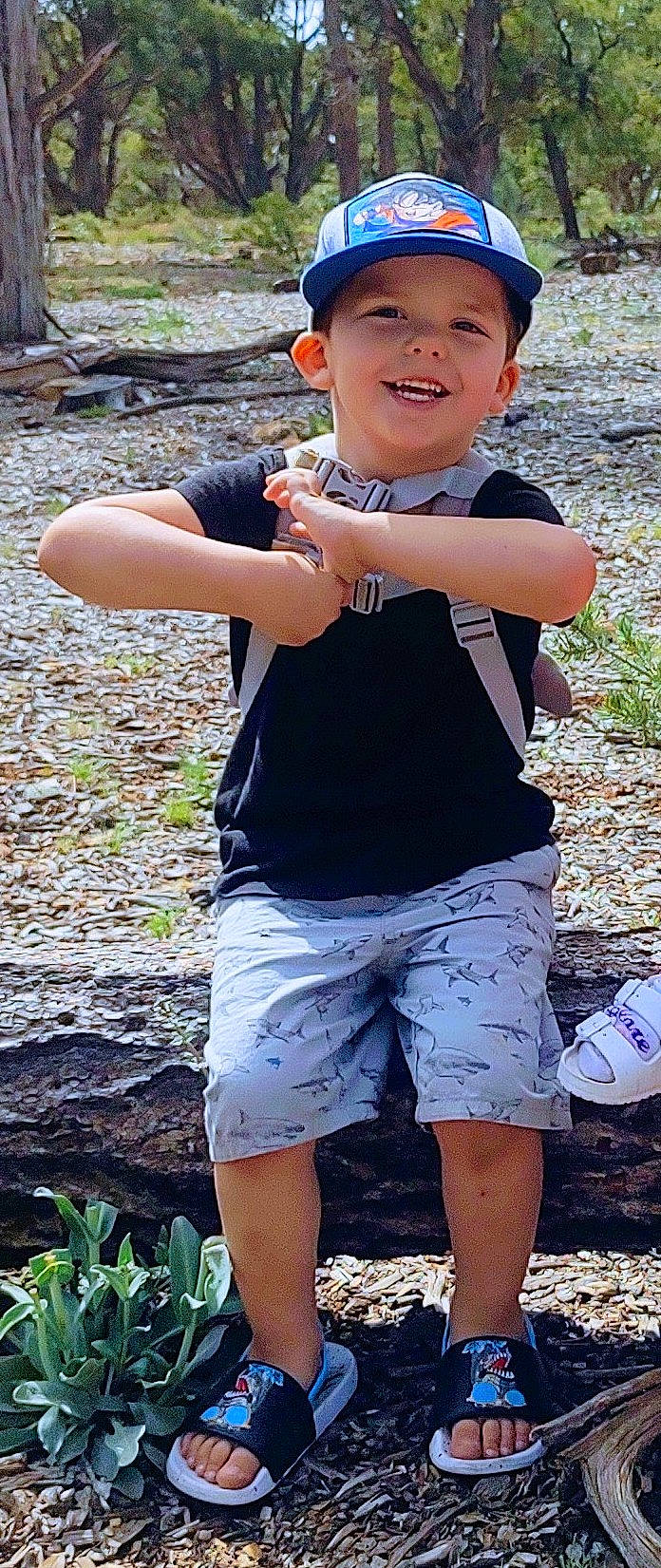 Wyatt joined the competition — help win amazing prizes! blue, cool, electric_blue, finger, fun, gesture, grass, green, happy, headwear, joy, leisure, people_in_nature, person, plant, shorts, sleeve, smile, standing, t_shirt