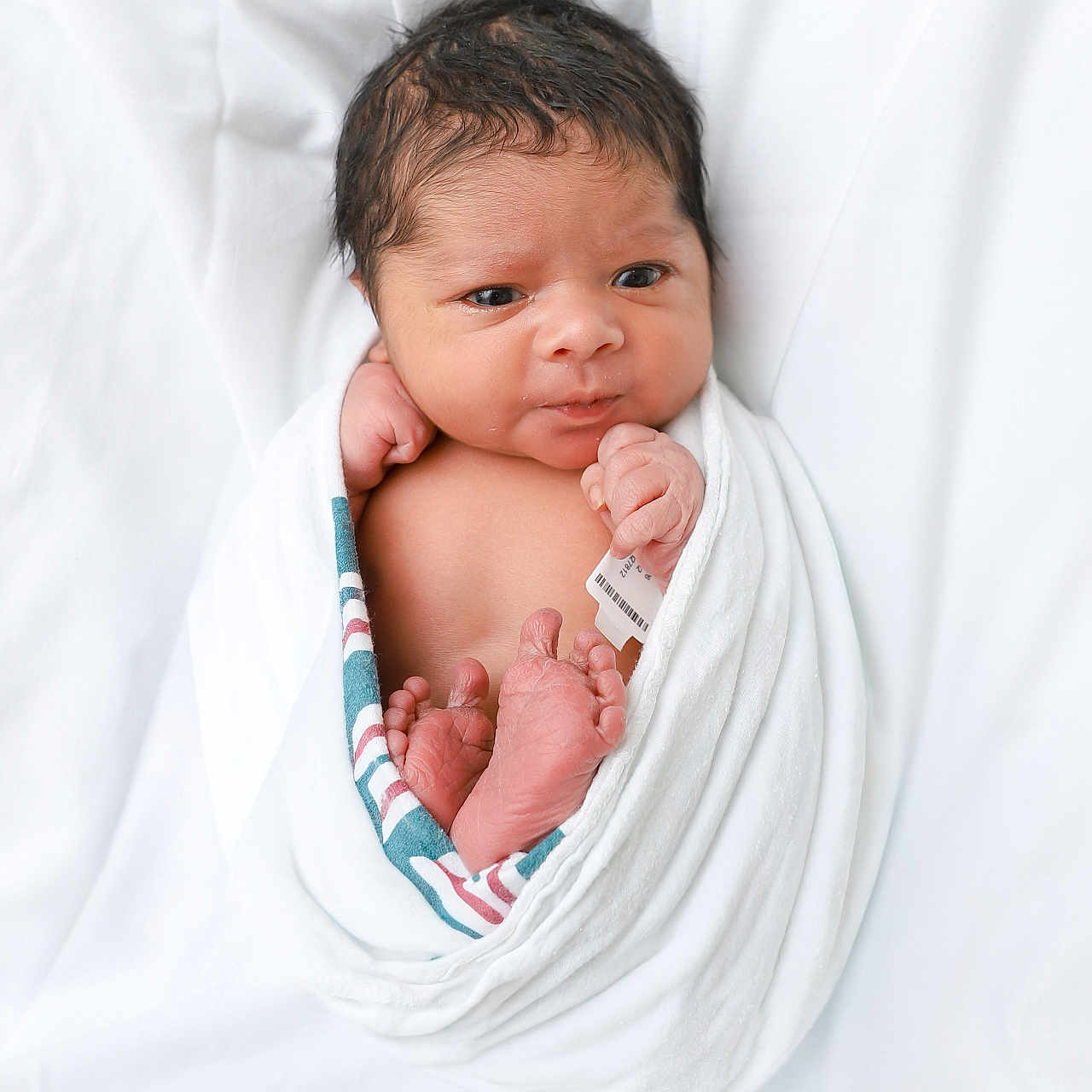Ahnaf H Ruzain joined the competition — help win amazing prizes! newborn, baby, infant, wrapped, blanket, hospital, bed, skin, face, feet, hand, portrait, cute, sleepwear, resting, fresh, young, person, indoors, soft