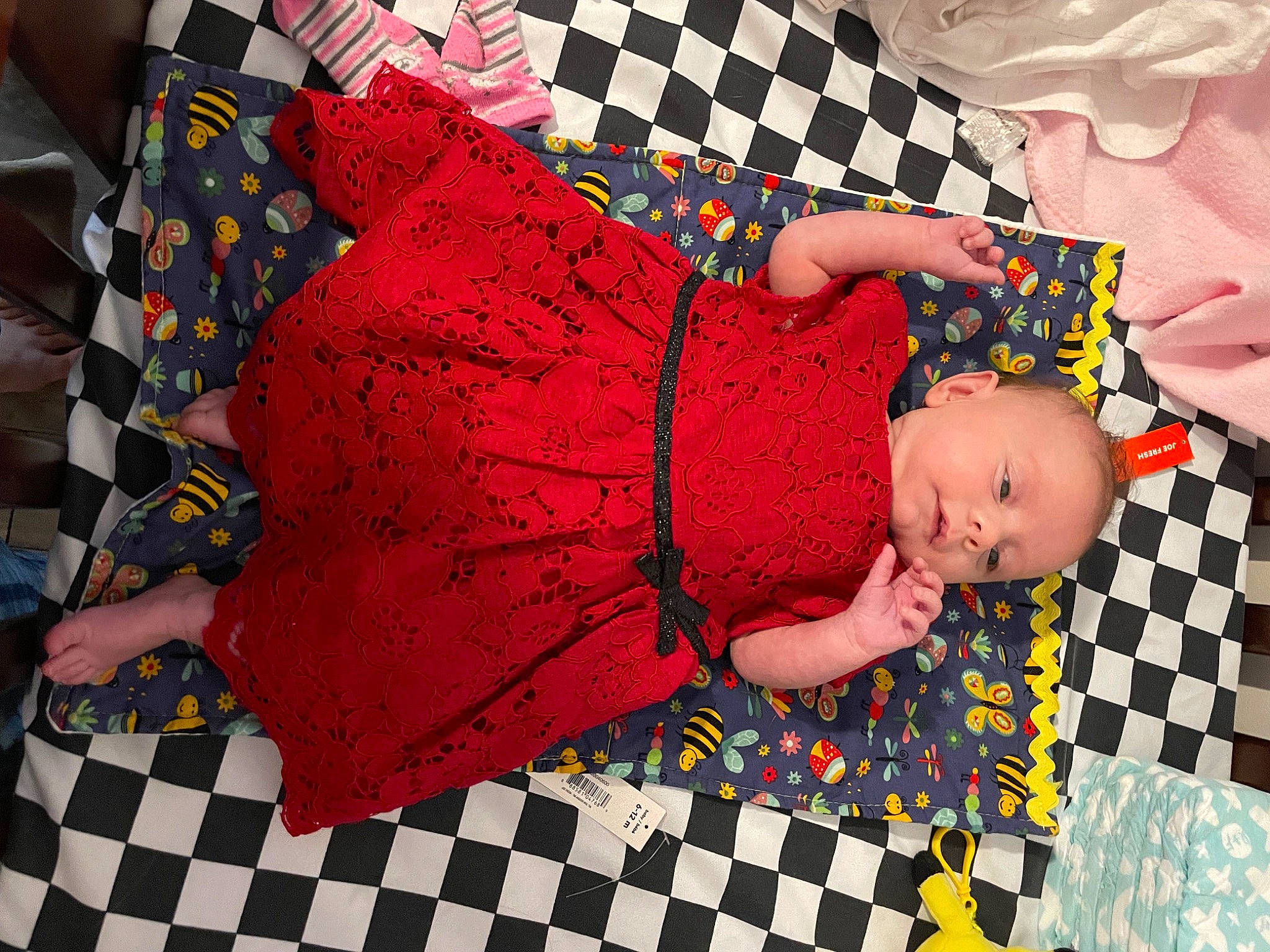 Mya joined the competition — help win amazing prizes! art, baby, baby_toddler_clothing, child, comfort, creative_arts, design, floor, flooring, linens, magenta, pattern, person, pink, plaid, red, room, sleeve, textile, toddler
