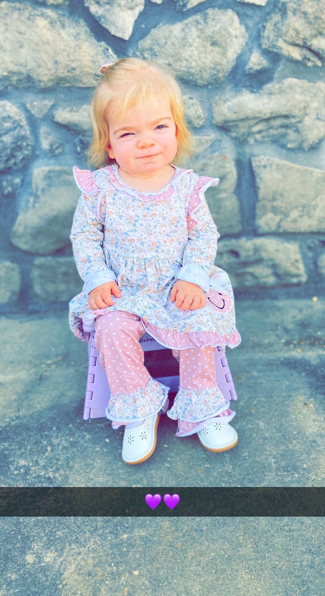 Everly is registered to the contest to win money with this photo: baby_toddler_clothing, cheek, child, chin, dress, eye, face, grass, hair, happy, head, lip, magenta, outerwear, pattern, person, pink, purple, skin, sleeve