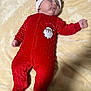 Sasha is registered to the contest to win money with this photo: baby, sleeping, infant, red_clothing, santa_hat, christmas_outfit, blanket, soft_texture, cute, holiday, festive, peaceful, child, one_piece_pajamas, indoors, portrait, holiday_theme, cozy, relaxed, sleep