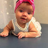 Nevaeh joined the competition — help win amazing prizes! baby, infant, child, pink_headband, bow, striped_clothing, smiling, face, eyes, hands, tummy, cute, portrait, indoor, soft_light, closeup, person, skin, expression, headwear
