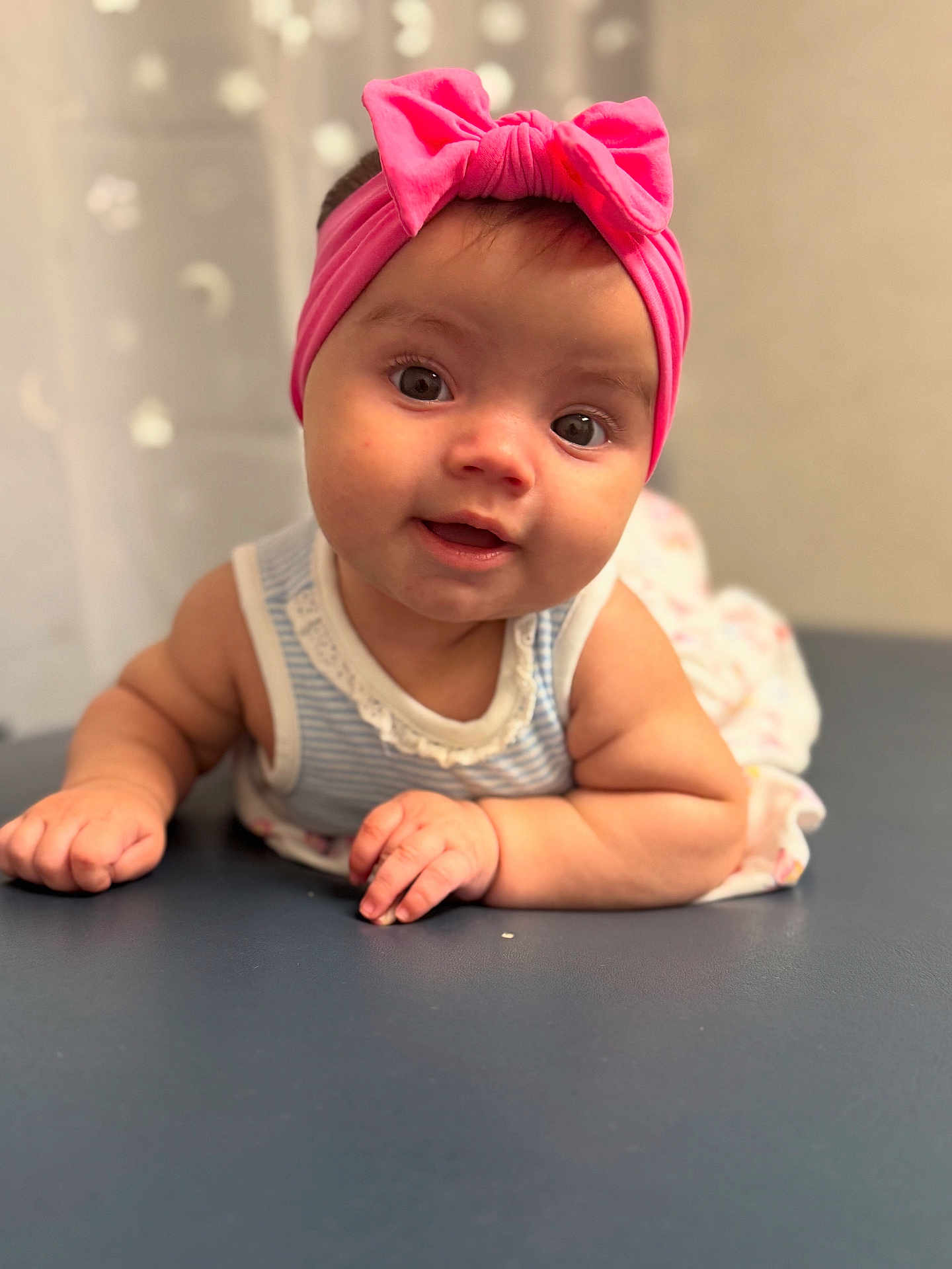 Nevaeh joined the competition — help win amazing prizes! baby, infant, child, pink_headband, bow, striped_clothing, smiling, face, eyes, hands, tummy, cute, portrait, indoor, soft_light, closeup, person, skin, expression, headwear