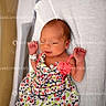 newborn, baby, infant, hospital, bassinet, wristband, floral_dress, sleeping, white_sheet, hospital_bed, child, person, portrait, cute, small_hands, peaceful, indoors, medical, newborn_photo, watermark
