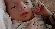 Zariah is registered to the contest to win money with this photo: baby, blanket, child, closeup, clothing, comfort, cozy, cute, face, hand, indoors, infant, newborn, portrait, resting, skin, sleepy, soft, toddler, warm