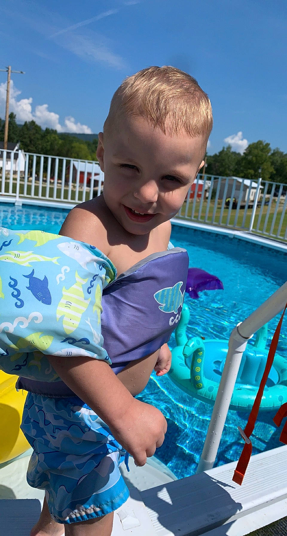 Benjamin is registered to the contest to win money with this photo: azure, baby_toddler_clothing, blue, child, cloud, electric_blue, fun, grass, happy, joy, leisure, mammal, person, personal_protective_equipment, product, recreation, sky, smile, summer, swimming_pool