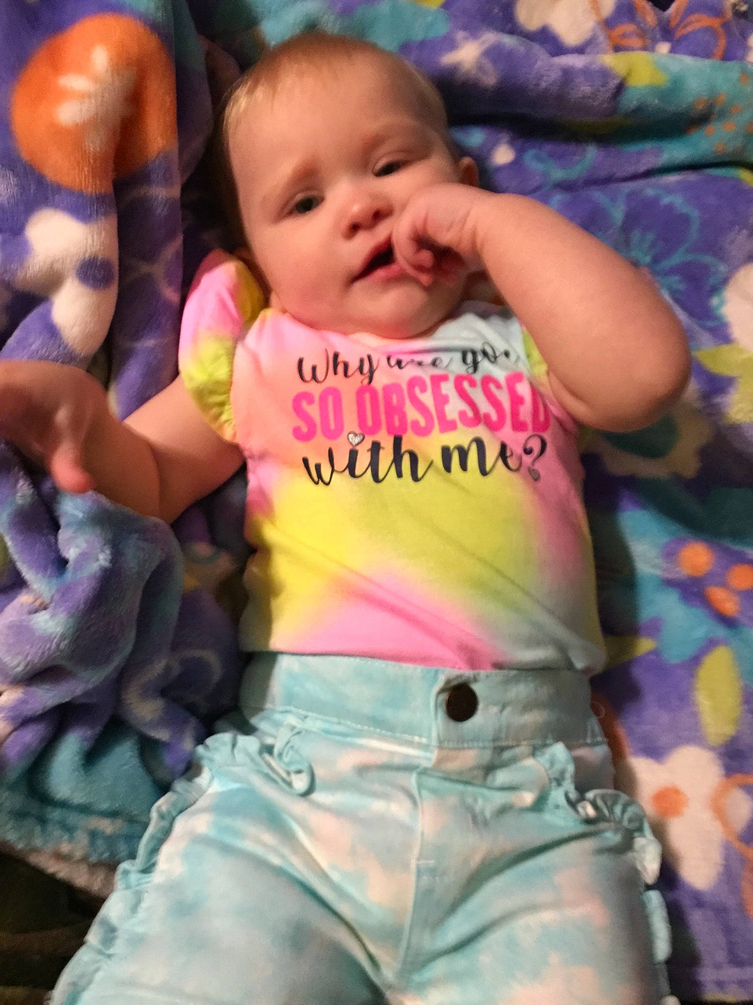 Flora is registered to the contest to win money with this photo: baby, baby_toddler_clothing, cheek, eye, face, facial_expression, finger, hand, happy, head, human_body, lip, mouth, nose, organ, person, pink, product, skin, sleeve