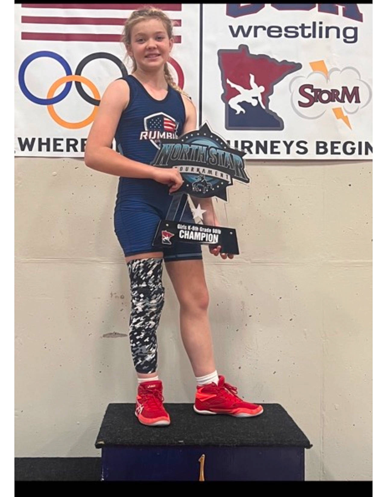 Makaylah is registered to the contest to win money with this photo: advertising, audio_equipment, boot, calf, championship, competition, competition_event, font, human_leg, joy, knee, logo, musical_instrument, person, physical_fitness, shorts, sports, sports_uniform, sportswear, stage_equipment