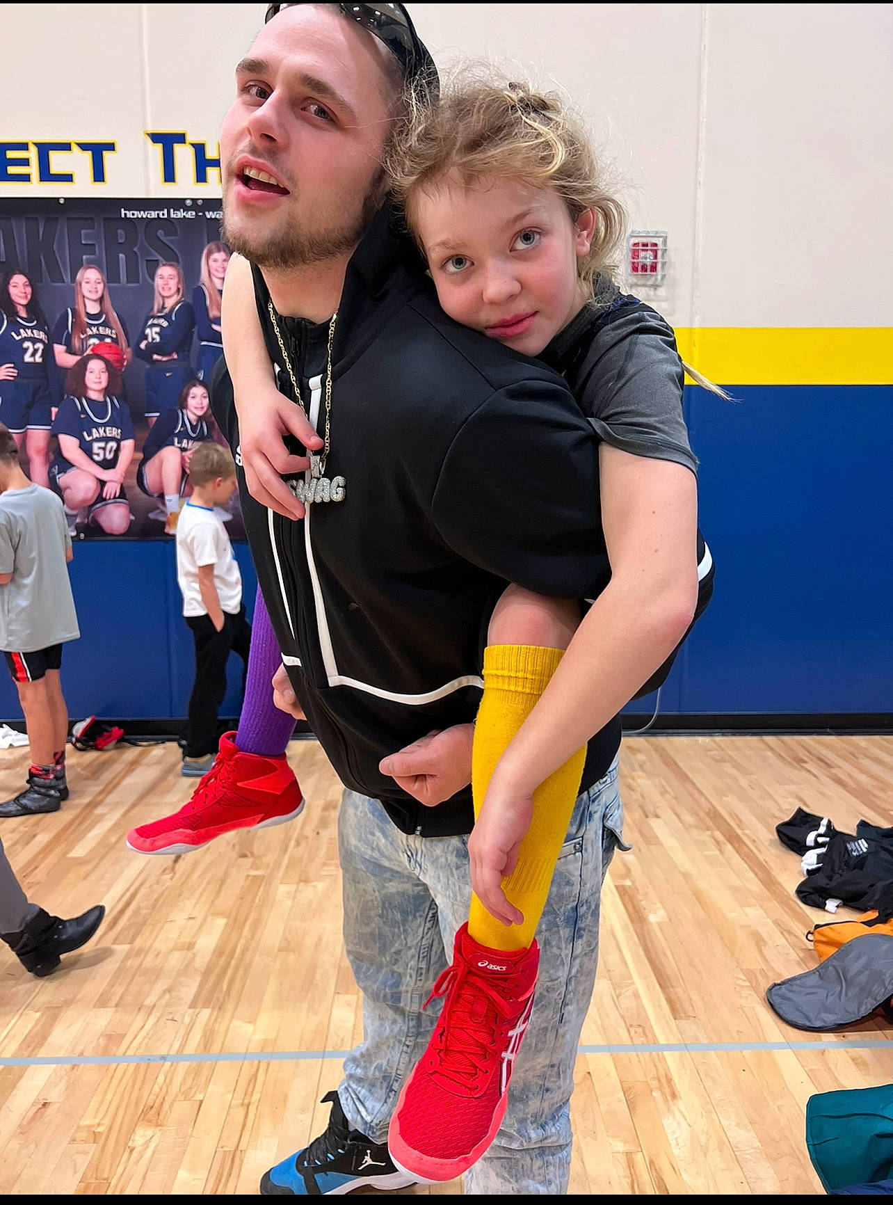 Makaylah is registered to the contest to win money with this photo: blurred, boot, entertainment, event, eyewear, fashion_design, flooring, footwear, fun, happy, hardwood, joy, knee, leisure, performing_arts, person, shoe, smile, sneakers, sportswear