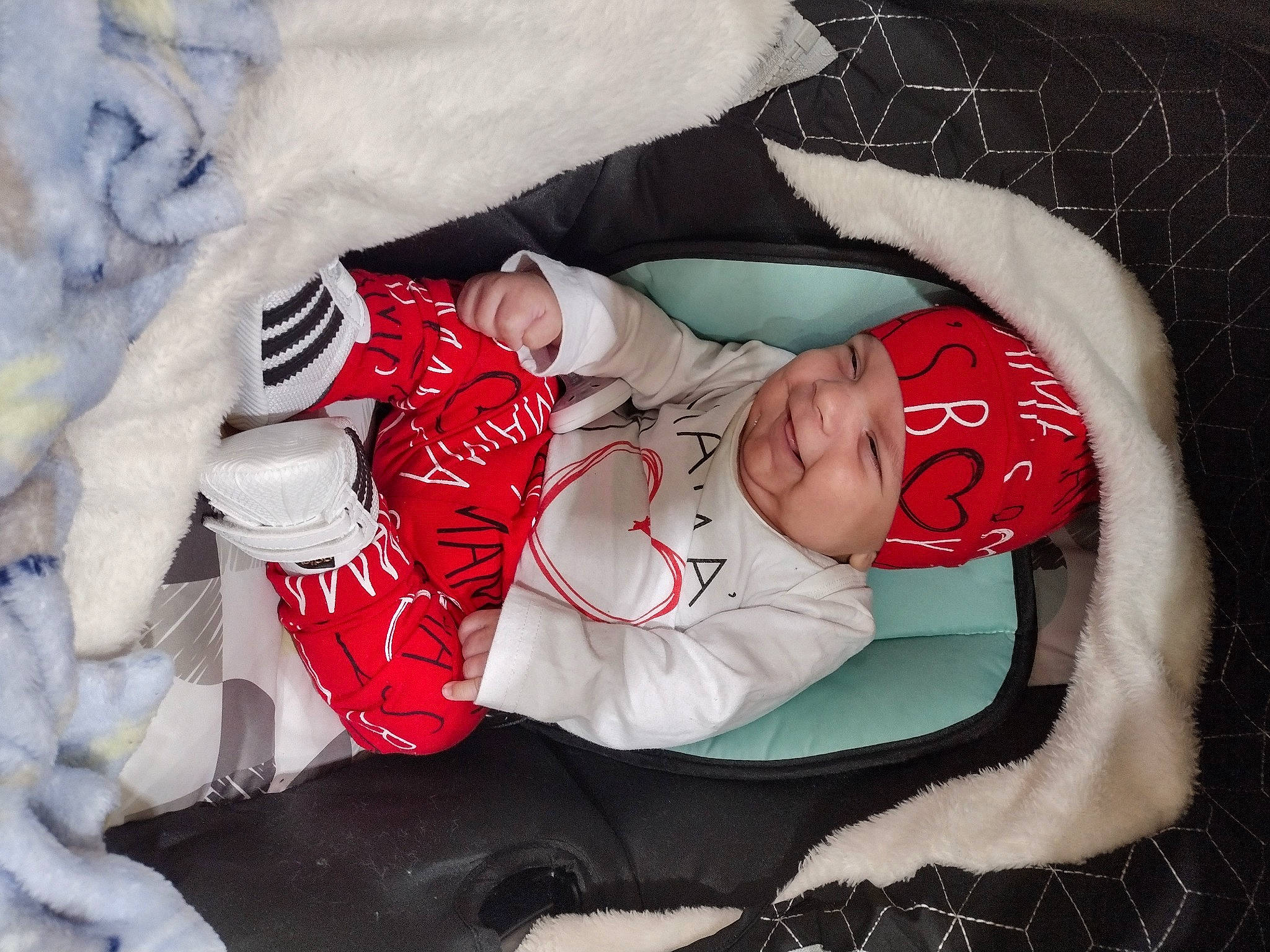Zaryan is registered to the contest to win money with this photo: baby, baby_products, baby_sleeping, baby_toddler_clothing, carmine, child, comfort, event, face, hand, hat, head, headwear, human_body, lap, linens, person, sleeve, sock, textile