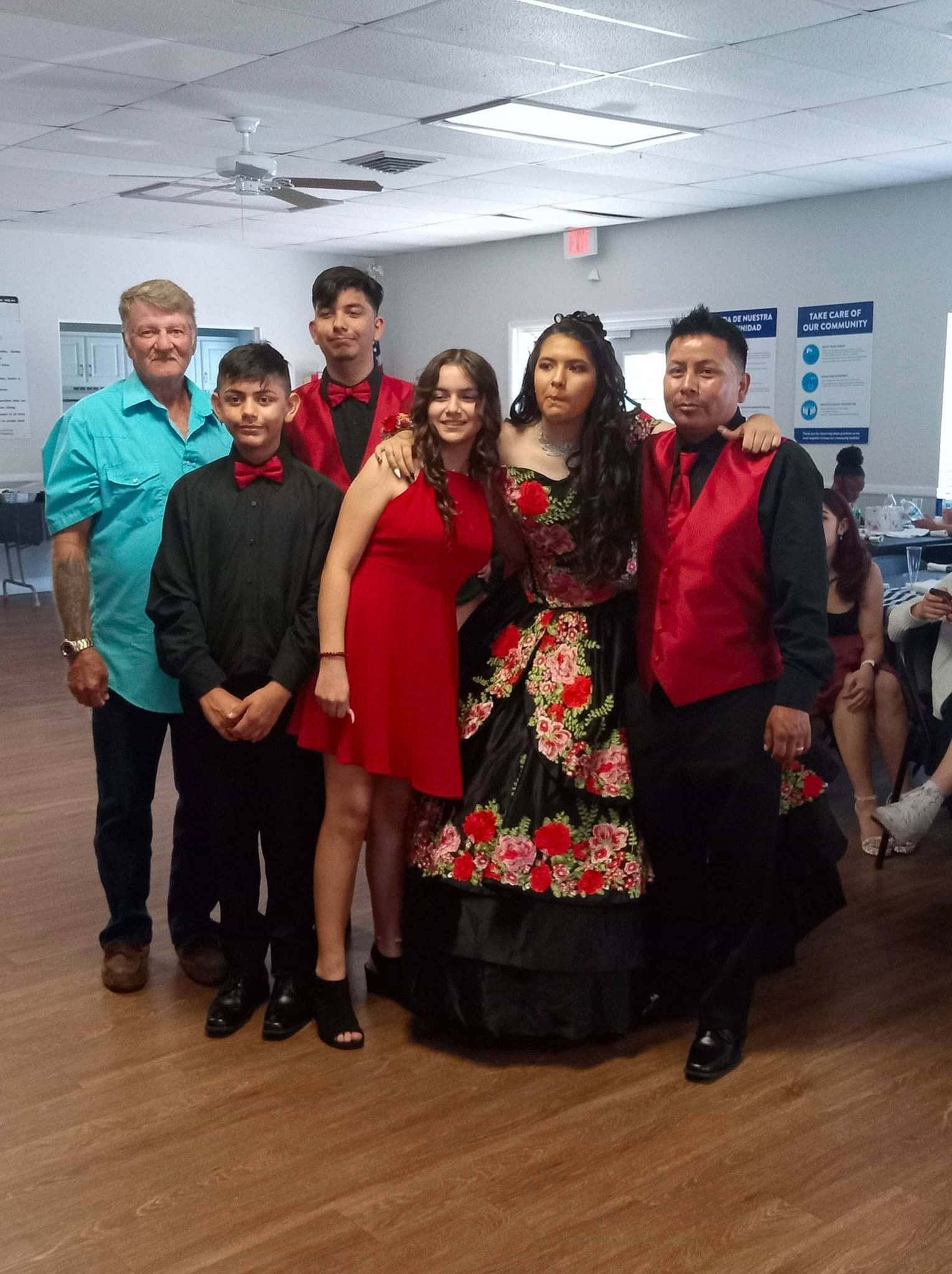 Alisycia is registered to the contest to win money with this photo: boot, chair, clothing, dress, event, eyewear, fashion_design, flooring, footwear, formal_wear, fun, joy, leg, leisure, person, shoe, smile, social_group, standing, suit