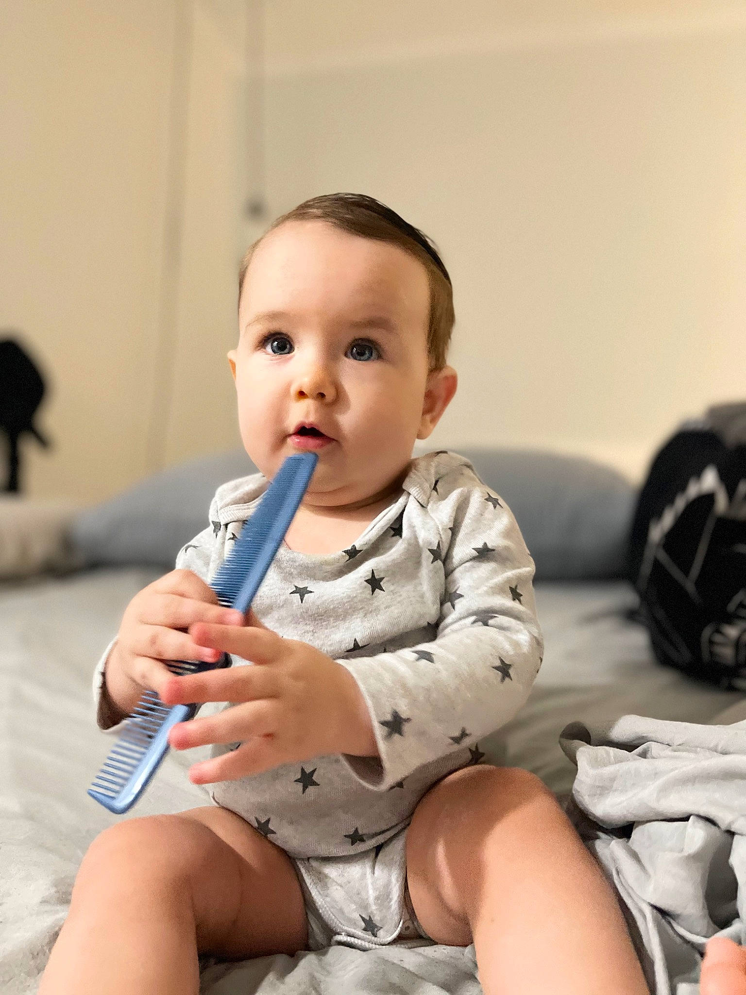 Lucas is registered to the contest to win money with this photo: baby, baby_toddler_clothing, cheek, child, comfort, elbow, flooring, fun, happy, head, human_leg, knee, leg, nail, person, sitting, skin, sleeve, surprise, thigh