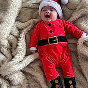 Luca is registered to the contest to win money with this photo: animal, baby, bear, blanket, cap, clothing, coat, face, glove, happy, hat, head, jacket, newborn, pants, person, photography, portrait, sleeping, yawning