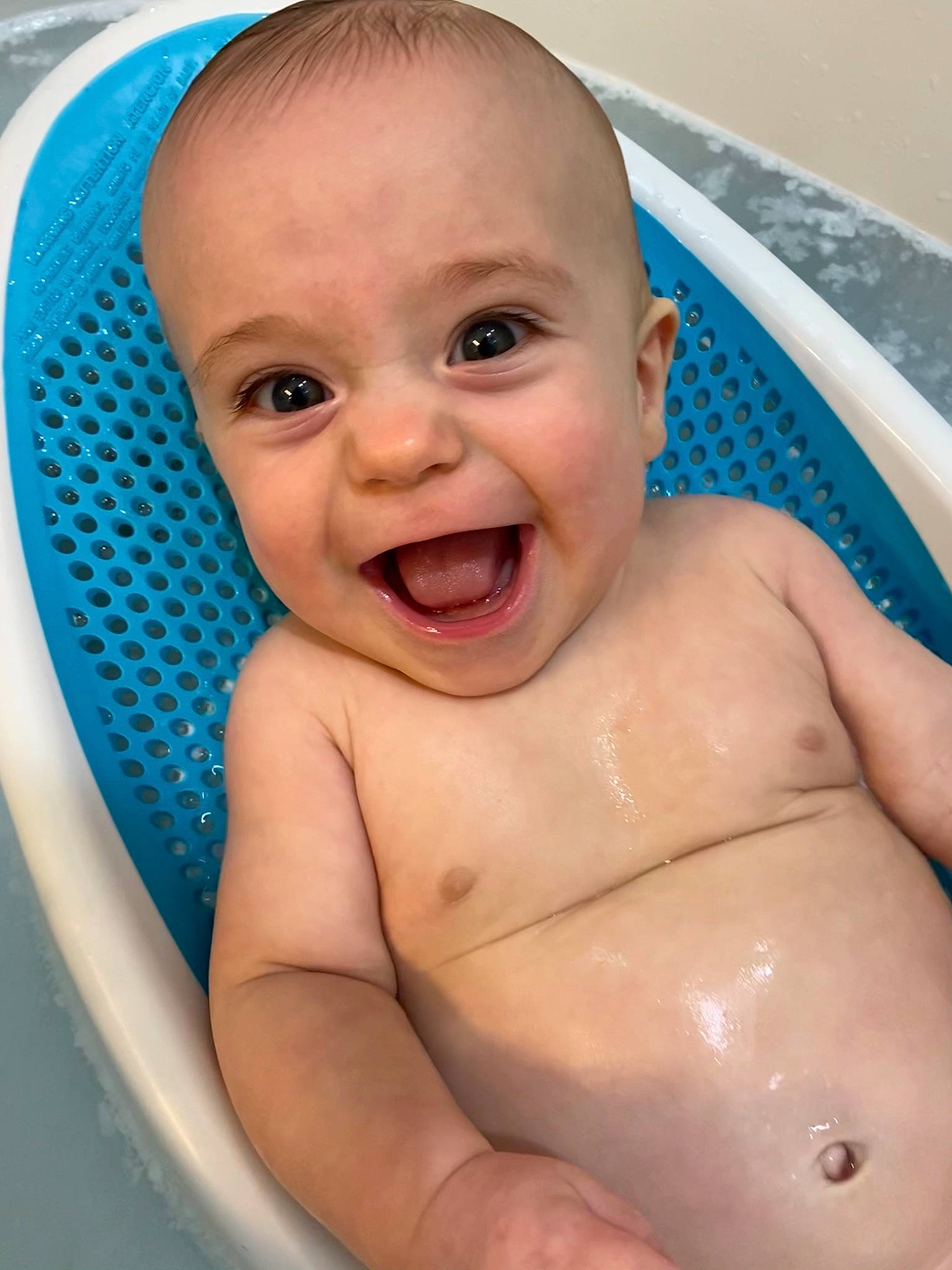 Hudson is registered to the contest to win money with this photo: abdomen, aqua, azure, baby, baby_bathing, barechested, blue, cheek, chest, child, eyebrow, face, iris, muscle, nose, organ, person, skin, stomach, toddler