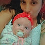 affection, baby, casual, closeup, comfort, cute, expression, face, floral_dress, heart_doodle, holding, indoor, love, mother_and_child, pacifier, portrait, red_headband, skin, tattoo, woman