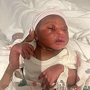 Nyla joined the competition — help win amazing prizes! newborn, baby, infant, hospital, blanket, hat, cap, hand, hospital_bracelet, clothing, person, skin, sleepy, indoors, closeup, wrapped, cute, newborn_baby, human, portrait