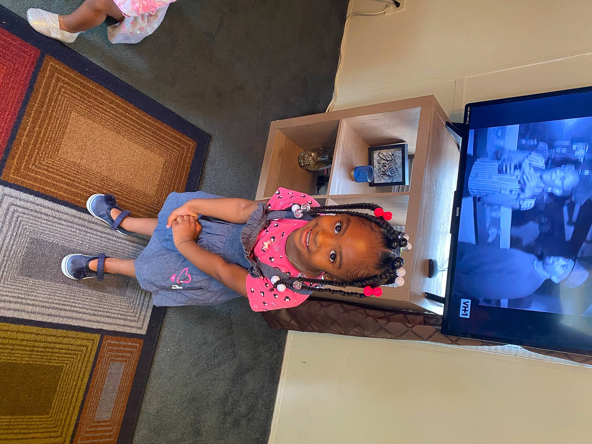 Avaya is registered to the contest to win money with this photo: art, display_device, electric_blue, flat_panel_display, flooring, fun, headwear, human_leg, joy, led_backlit_lcd_display, leisure, magenta, multimedia, person, room, sandal, t_shirt, television_set, thigh, toddler