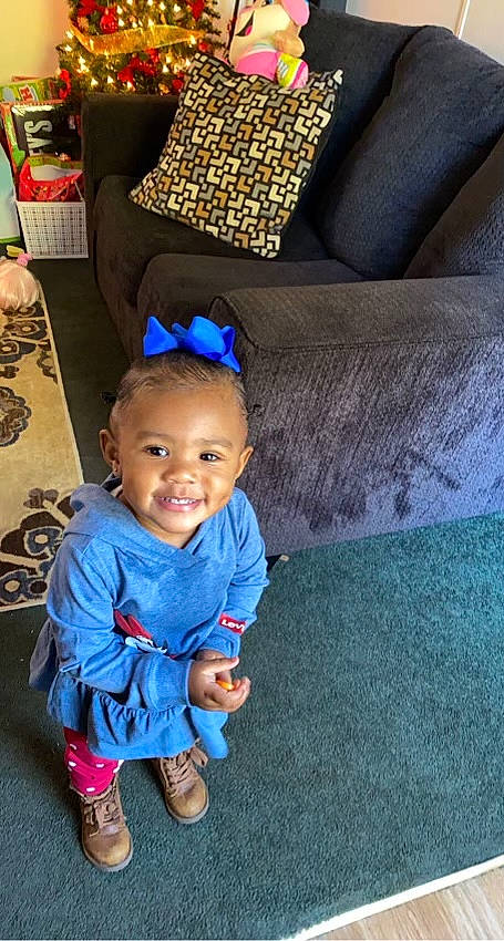 Zaira joined the competition — help win amazing prizes! azure, baby, baby_toddler_clothing, child, comfort, couch, electric_blue, eye, floor, flooring, fun, hairstyle, happy, head, joy, leg, leisure, person, smile, textile