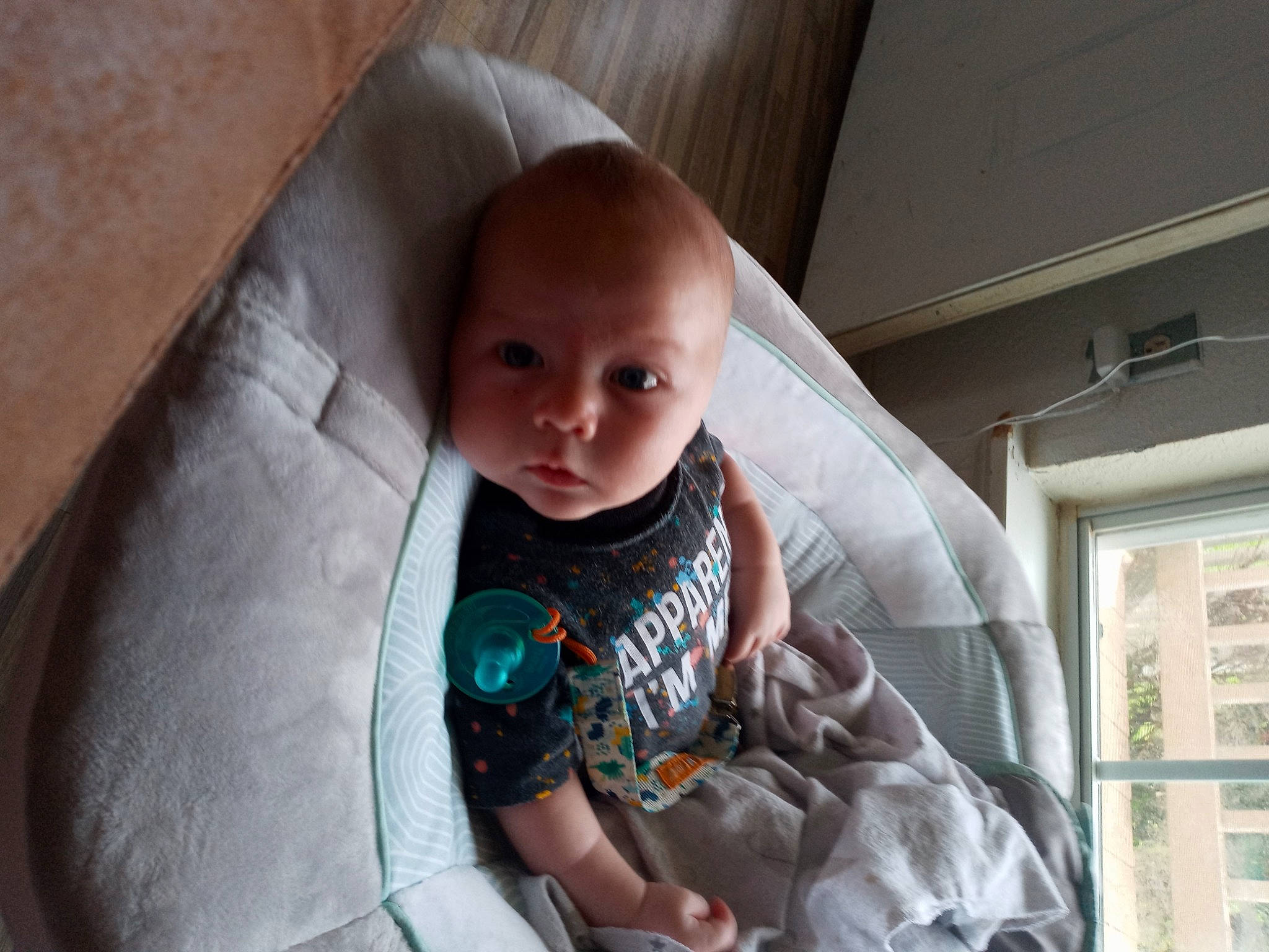 Micheal joined the competition — help win amazing prizes! baby, baby_products, baby_toddler_clothing, cheek, child, comfort, dress, finger, hand, happy, linens, person, room, sitting, skin, smile, thumb, toddler, tree, window