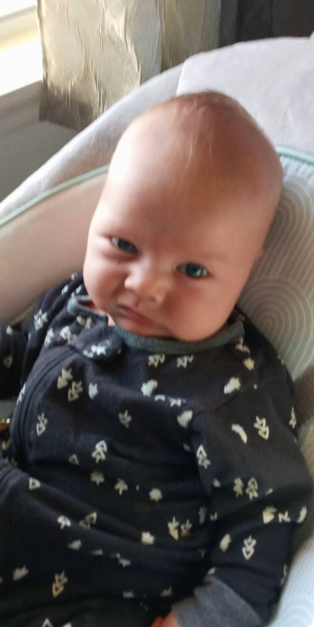 Micheal is registered to the contest to win money with this photo: baby, baby_toddler_clothing, cheek, child, collar, comfort, eye, eyebrow, human_body, iris, lip, pattern, person, sitting, skin, sleeve, t_shirt, toddler, vehicle_door, windshield